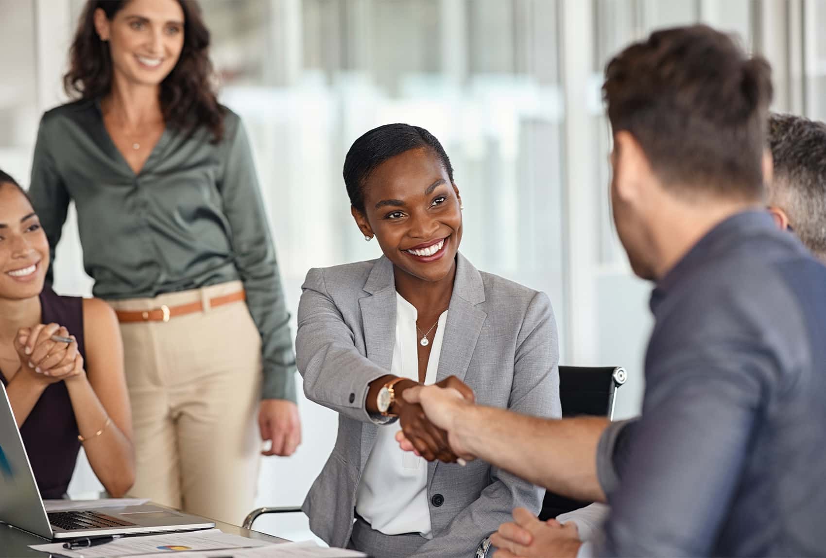 professionals shaking hands in a partnership
